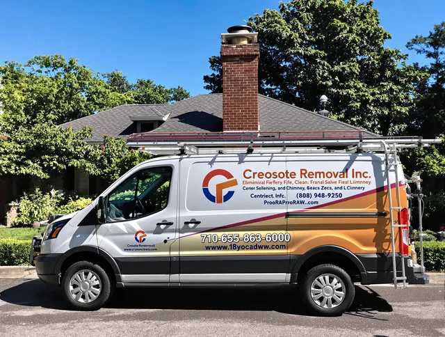 Raynham Chimney Sweep technician removing creosote safely in Raynham, MA