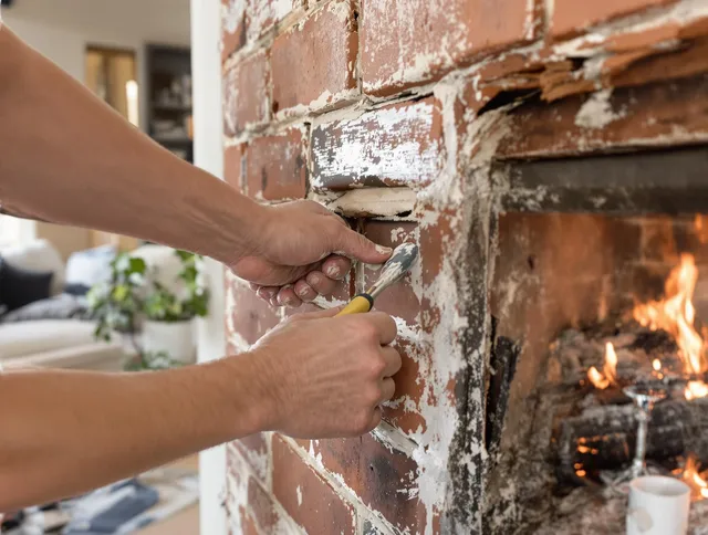 Routine fireplace repair by Raynham Chimney Sweep in Raynham, MA